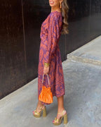 Women's Long Sleeve Midi Dress with Deep V-Neckline and Twisted Knot Waist Detail in Amber Botanical Print