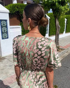 Women's Maxi Dress with Deep V-Neckline and Twisted Front Knot Waist Detail and Abstract Print