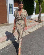 Women's Maxi Dress with Deep V-Neckline and Twisted Front Knot Waist Detail and Abstract Print