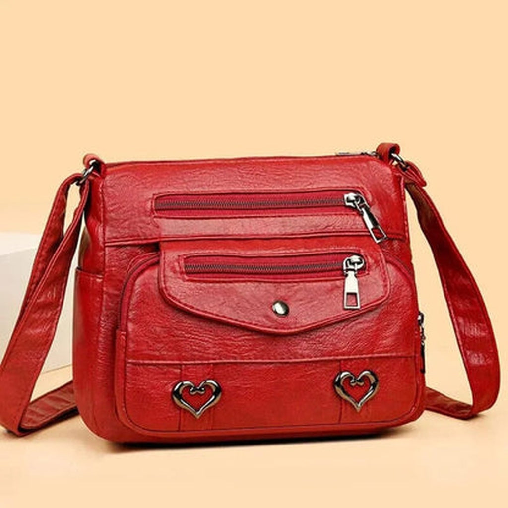Women's Multi-Pocket Shoulder Bag with Heart Hardware and Front Zip Pockets