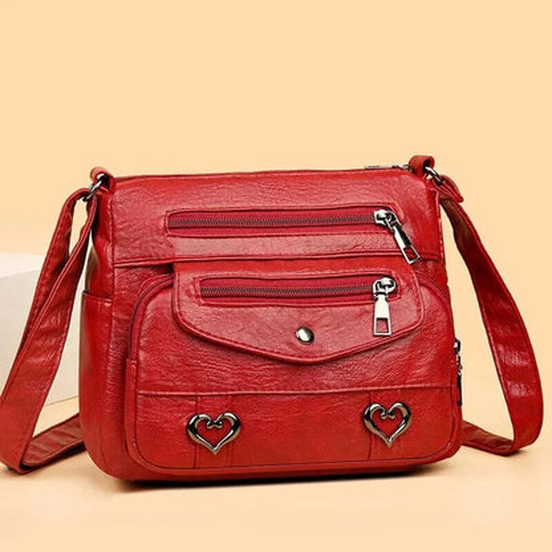Women's Multi-Pocket Shoulder Bag with Heart Hardware and Front Zip Pockets