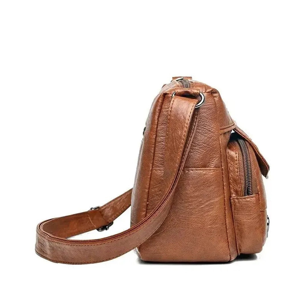 Women's Multi-Pocket Shoulder Bag with Heart Hardware and Front Zip Pockets