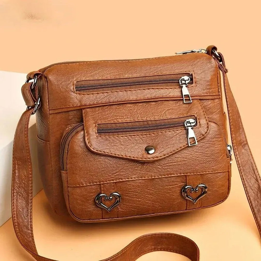 Women's Multi-Pocket Shoulder Bag with Heart Hardware and Front Zip Pockets