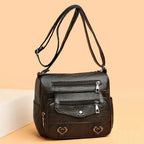 Women's Multi-Pocket Shoulder Bag with Heart Hardware and Front Zip Pockets