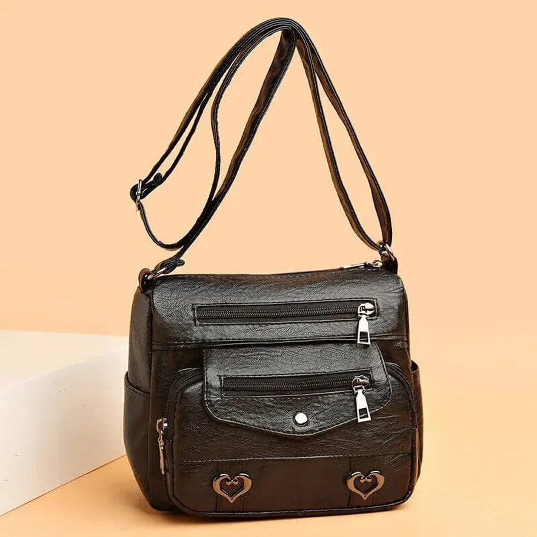 Women's Multi-Pocket Shoulder Bag with Heart Hardware and Front Zip Pockets