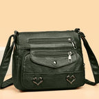 Women's Multi-Pocket Shoulder Bag with Heart Hardware and Front Zip Pockets