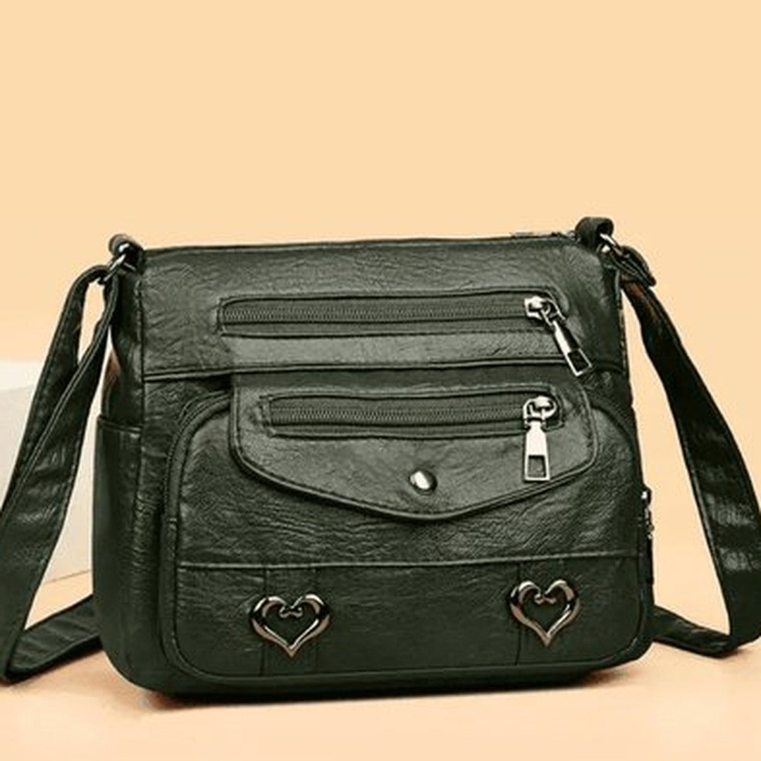 Women's Multi-Pocket Shoulder Bag with Heart Hardware and Front Zip Pockets