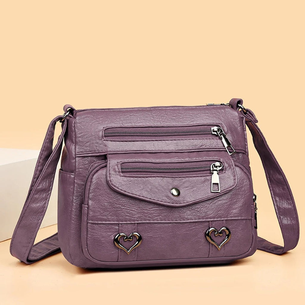 Women's Multi-Pocket Shoulder Bag with Heart Hardware and Front Zip Pockets