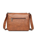 Women's Multi-Pocket Shoulder Bag with Heart Hardware and Front Zip Pockets