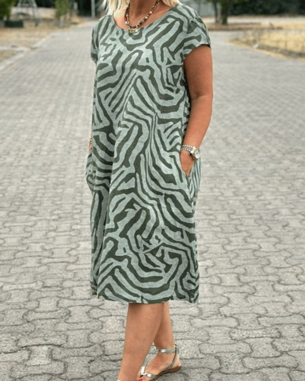 Women's Short Sleeve Dress with Abstract Swirl Print Round Neckline and Side Pockets