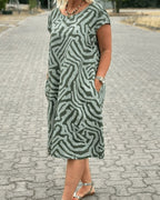 Women's Short Sleeve Dress with Abstract Swirl Print Round Neckline and Side Pockets