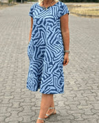 Women's Short Sleeve Dress with Abstract Swirl Print Round Neckline and Side Pockets