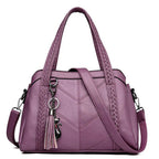 Women's Structured Handbag with Braided-Trim Handles Chevron Panel Front and Tassel Charm Detail